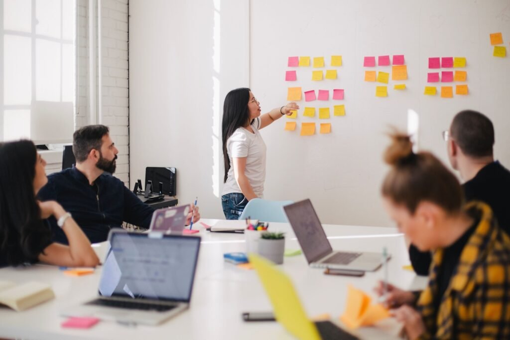 Web design team planning a website strategy using sticky notes
